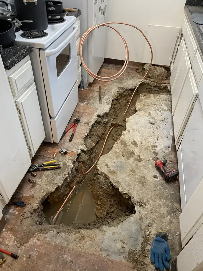 Kitchen floor trenched open to reach a leaking copper line under the slab in Hayward