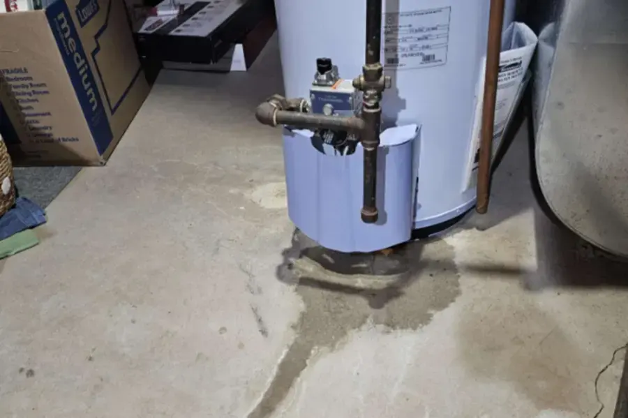 Water spreading across a garage floor from a leaking water heater in Hayward